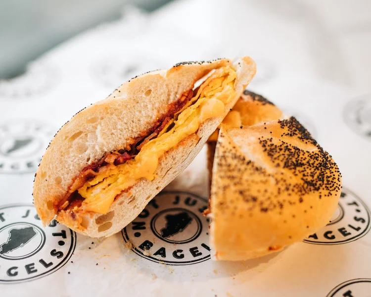 A bacon, egg, and cheese bagel sandwich